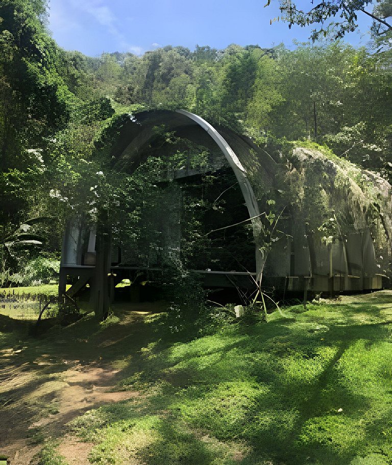 Refugio aconchegante na floresta Aldeia Rizoma