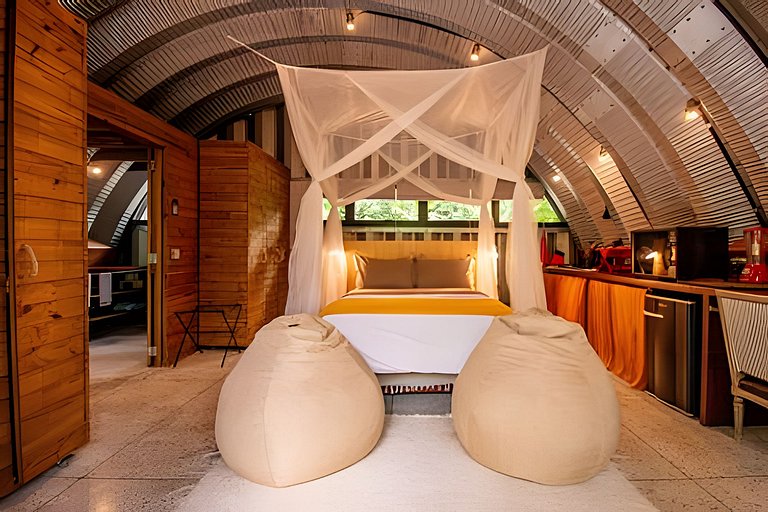 Refugio aconchegante na floresta Aldeia Rizoma