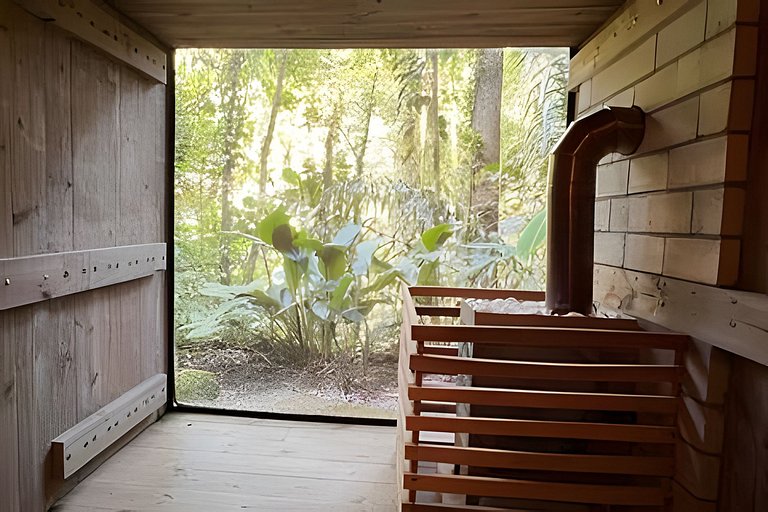 Refugio aconchegante na floresta Aldeia Rizoma